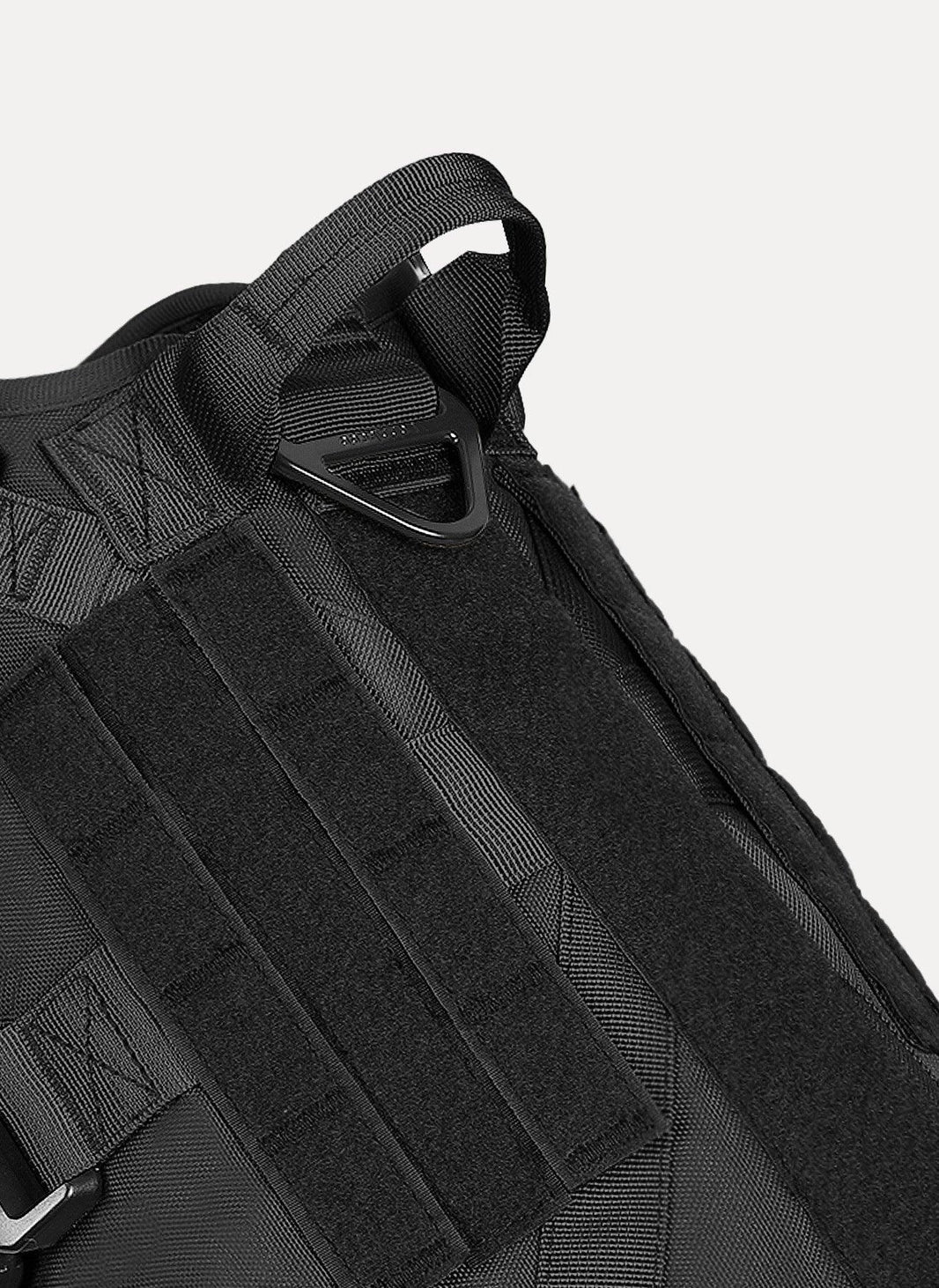 Black tactical dog harness by Paw 9 Gear with adjustable straps and sturdy design for outdoor activities.